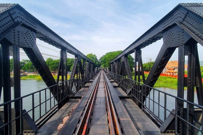 A steel bridge with a river underneath. 3