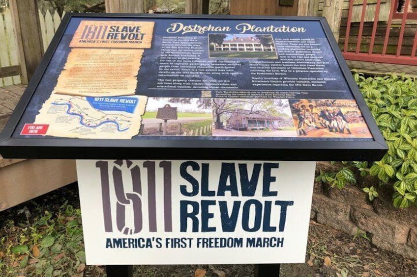An informational display about the 1811 Slave Revolt, featuring historical documents and a map. 4