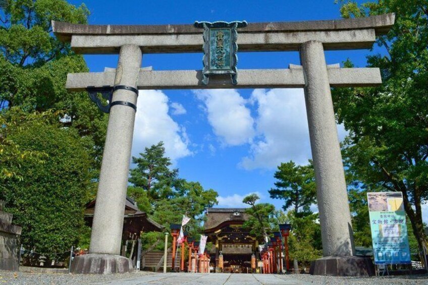 A traditional Japanese torii gate with a shrine in the background. 5