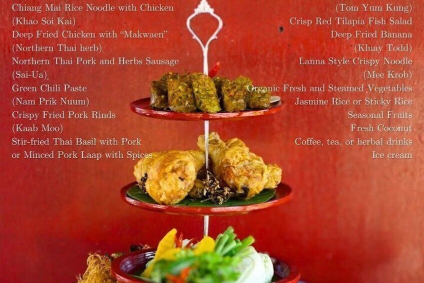 A three-tiered food display with various Asian dishes. 2