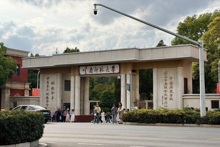 A large building with columns and a sign in a foreign language. 3