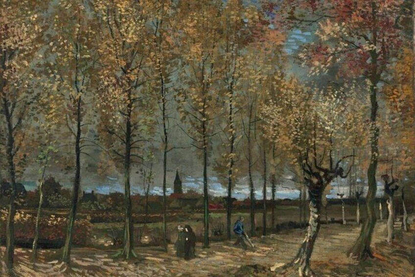 A forest with autumn-colored trees and a path. 1