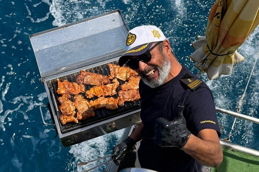 A person grilling meat on a boat. 3