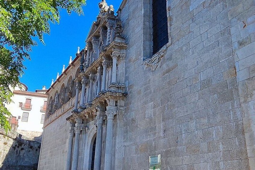 A historic building with ornate architectural details, including columns and decorative elements. 3