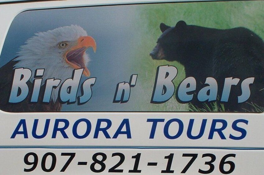 A tour advertisement with a bird and a bear, and a phone number. 1