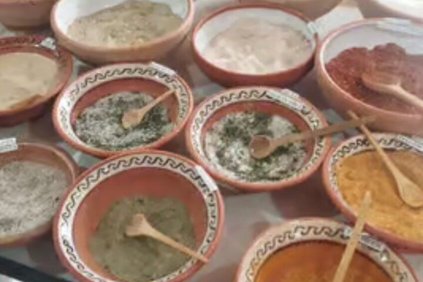 A variety of bowls with different spices and herbs. 2