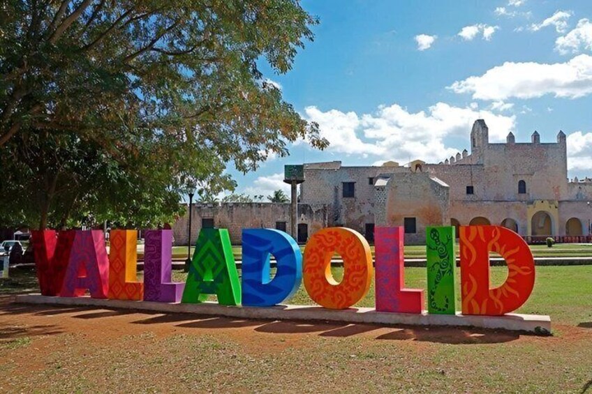 Colorful letters spelling 'VALADOLID' with a historic building in the background. 3