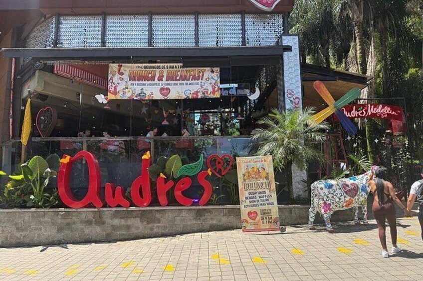 A restaurant named 'Andres' with a colorful sign and a 'Breakfast & Breakfast' banner. 3