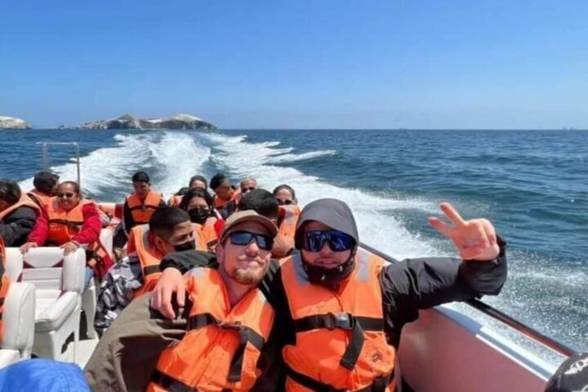 A boat with people wearing life jackets, water splashing around, and a clear blue sky. 5