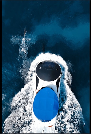 A boat speeding through the ocean. 3