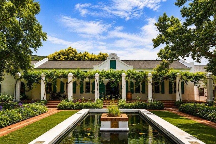 A building with a garden, a pool, and a pergola. 3