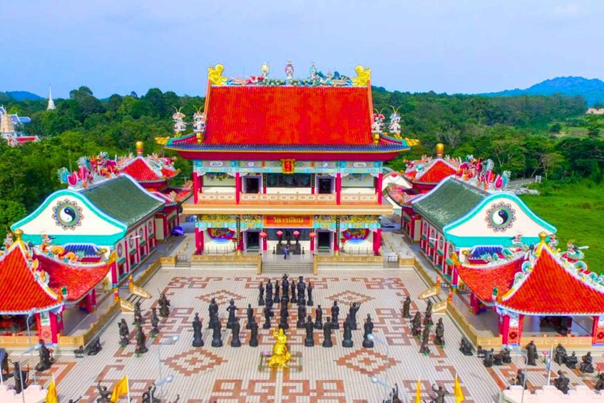 A traditional Chinese temple with ornate architecture and a courtyard. 4