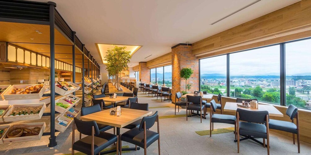 A modern dining area with large windows overlooking a cityscape. 2