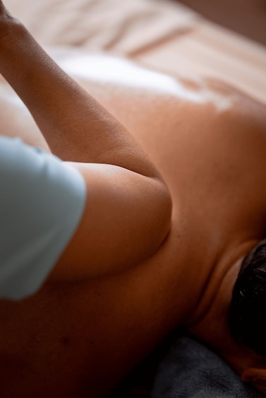 A close-up of a person's arm and shoulder. 2