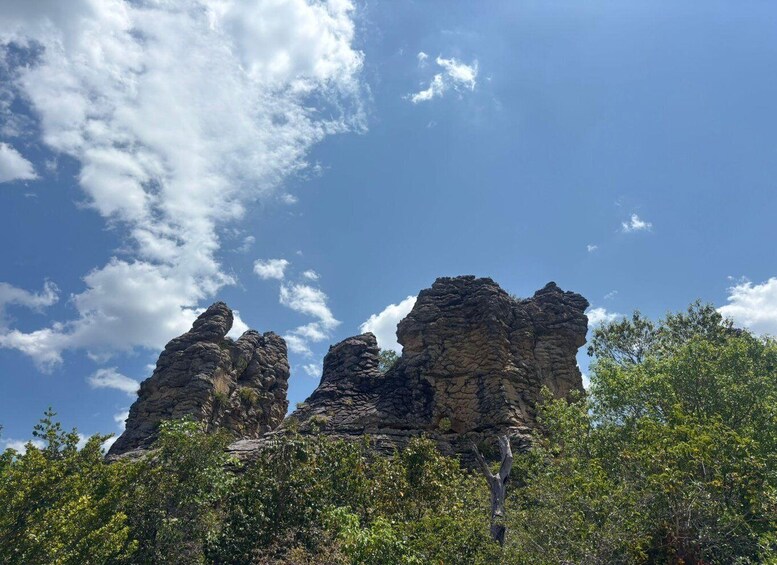 A rocky outcrop with a clear sky. 3