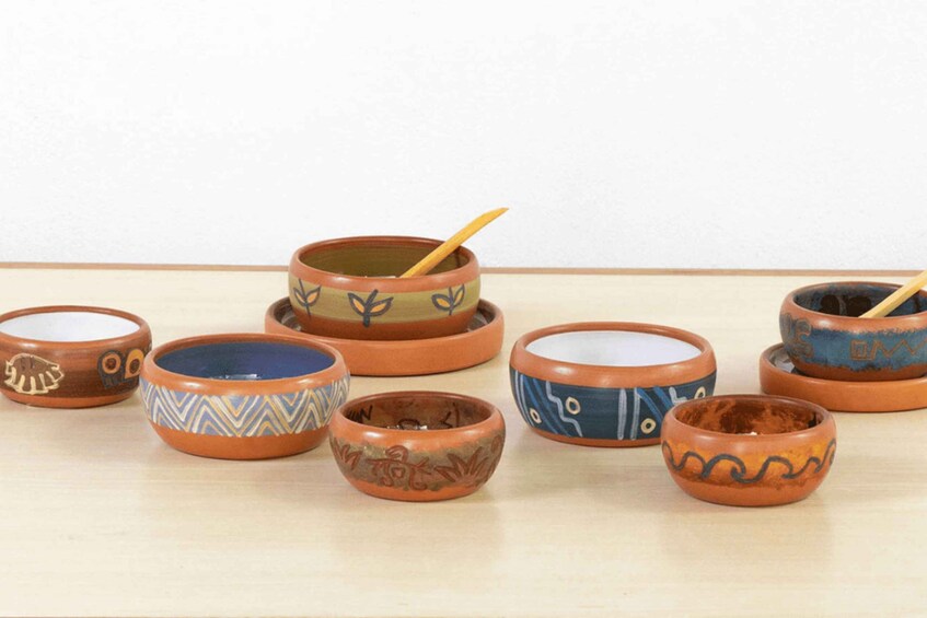 A collection of small, intricately decorated ceramic bowls. 5