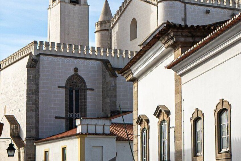 A historic building with a bell tower and arched windows. 4