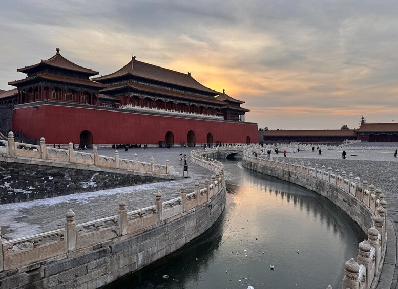 A traditional Chinese building with a curved waterway in front. 1