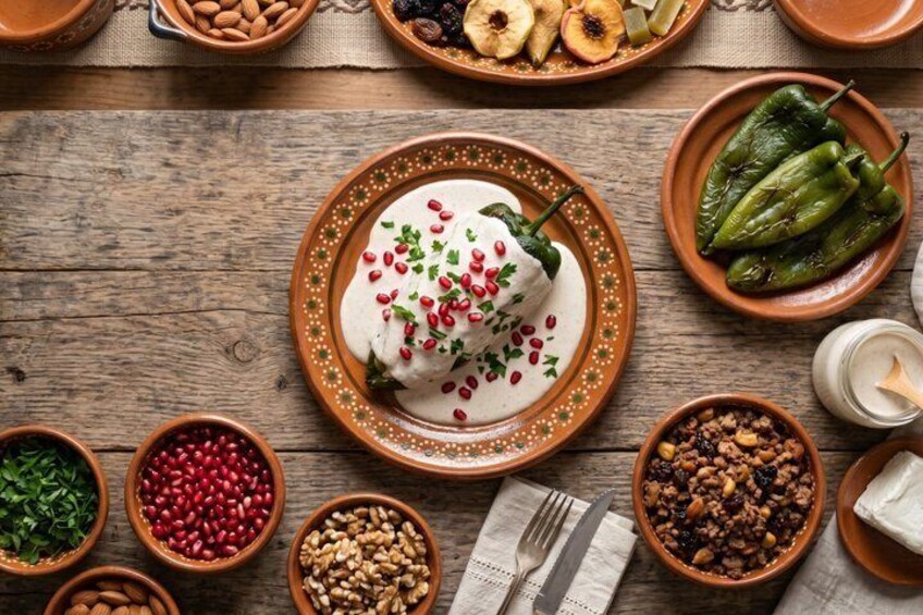 A variety of traditional dishes and ingredients on a wooden table. 1