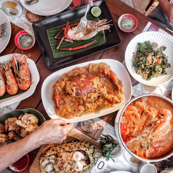 A variety of seafood dishes including shrimp, crab, and a seafood stew. 4