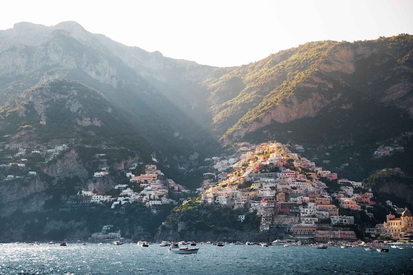 A coastal town with colorful buildings perched on a hillside. 4