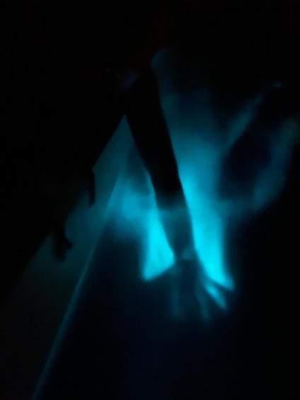 A dark scene with blue light patterns. 2