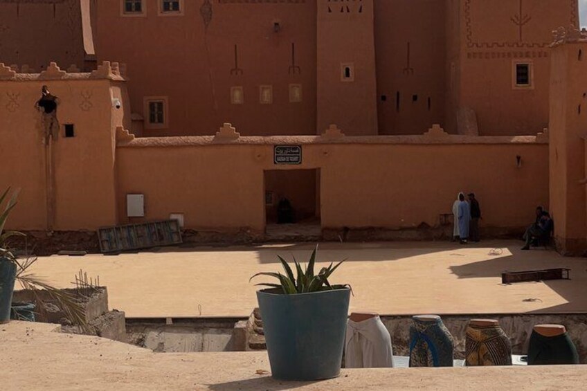A traditional building with a flat roof and a large open courtyard. 3