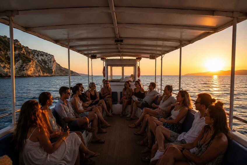 A group of people seated on a boat during sunset. 5