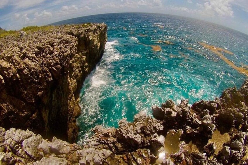 A rocky coastline with clear turquoise waters. 2