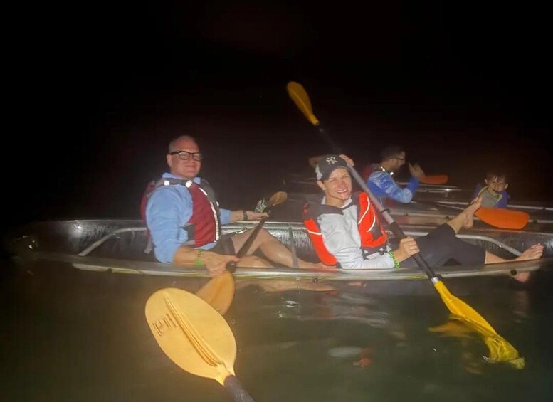 People in a boat at night. 5