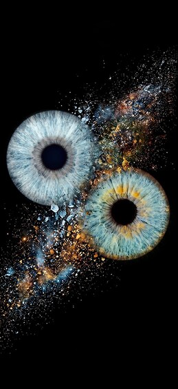 Two large, detailed eyes with a cosmic background. 1