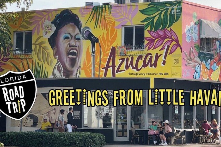 A colorful mural with a microphone and the word 'Azucar!' on a building. 1
