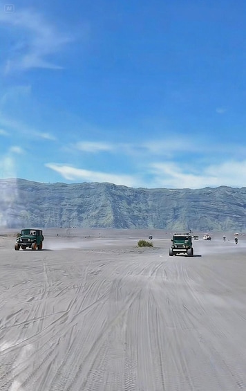 A desert landscape with two vehicles driving on a dusty road, surrounded by mountains. 1