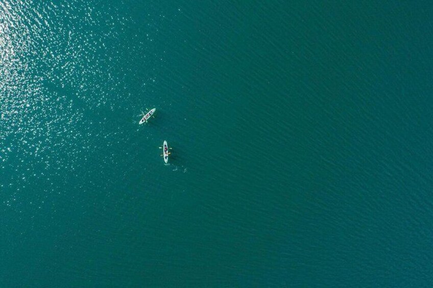 Two boats on a calm, turquoise sea. 5