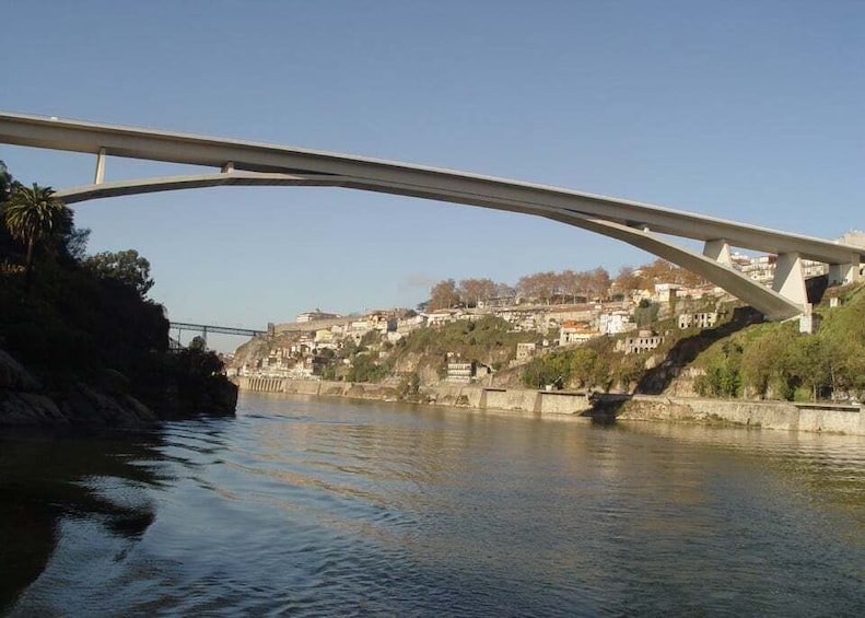 A bridge over a river with buildings on the opposite bank. 4