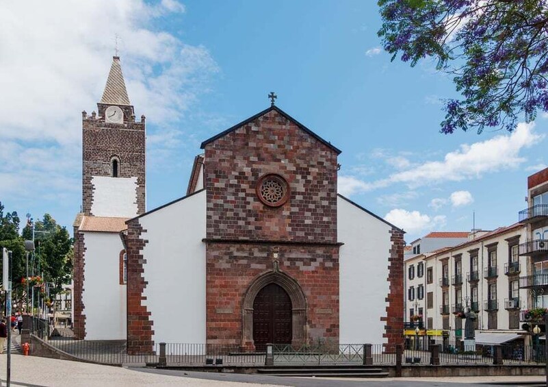 A church with a clock tower and a brick facade. 4