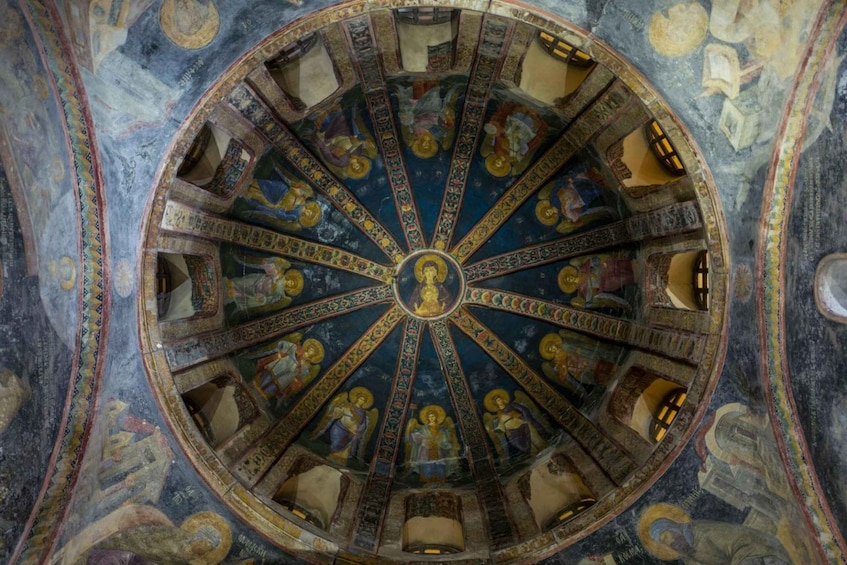 A domed ceiling with intricate mosaics and a central figure. 5