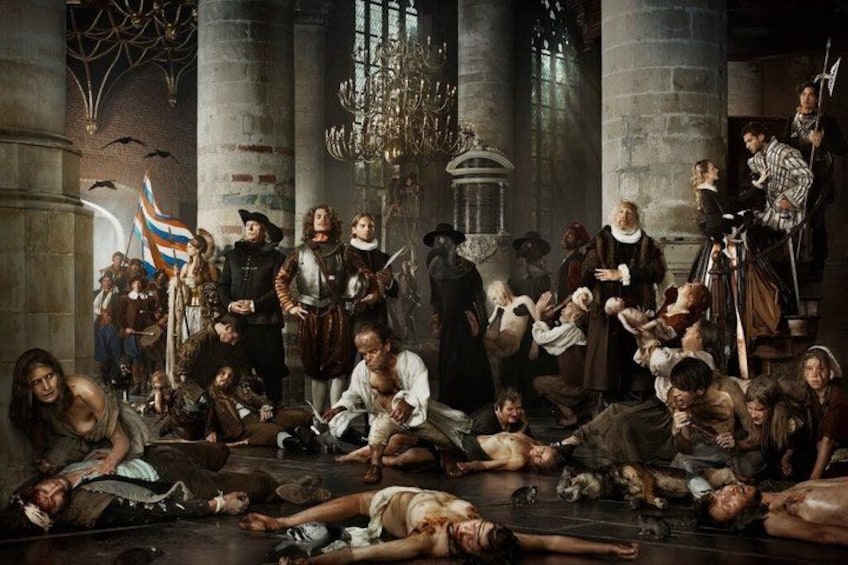 A historical scene with people in period clothing, a chandelier, and a flag. 2