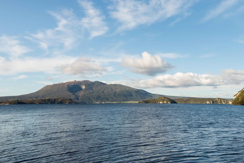 A calm lake with a mountain in the background. 5