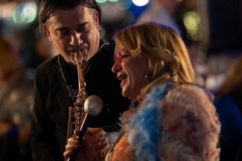 A person playing a saxophone. 2