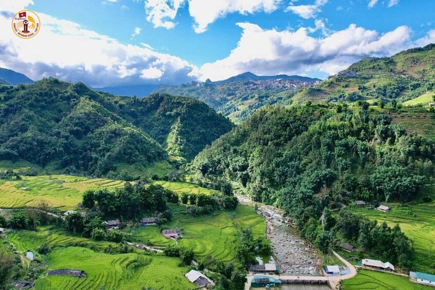 Terraced rice fields, a river, and a village nestled in a valley. 3