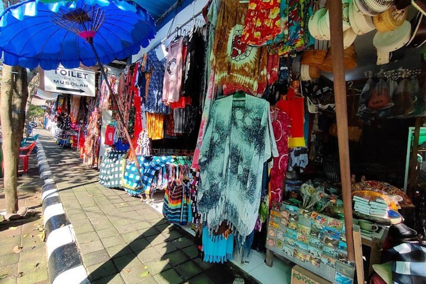 A market street with stalls selling textiles and souvenirs. 3