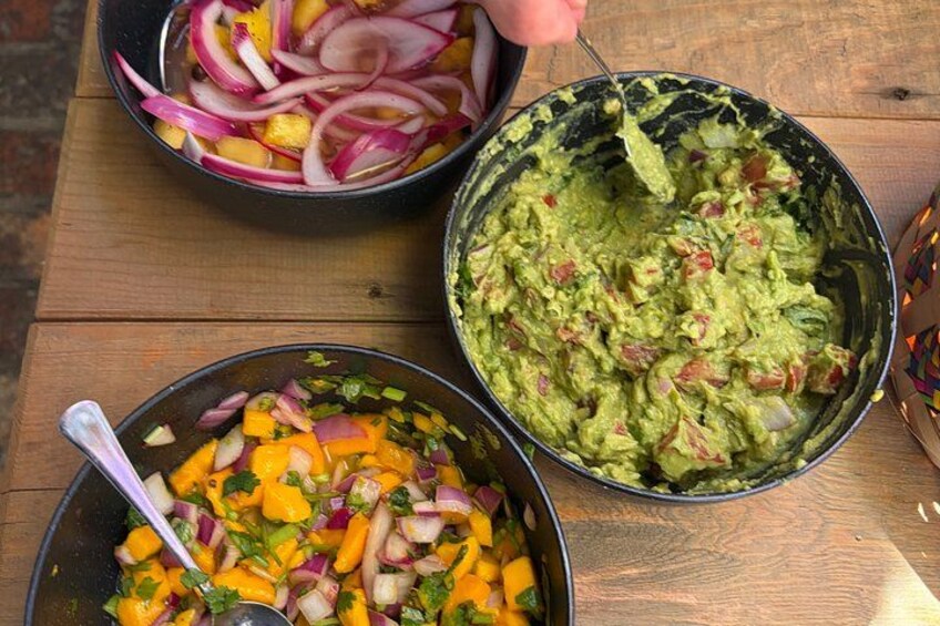 Three bowls of food on a wooden table. 4