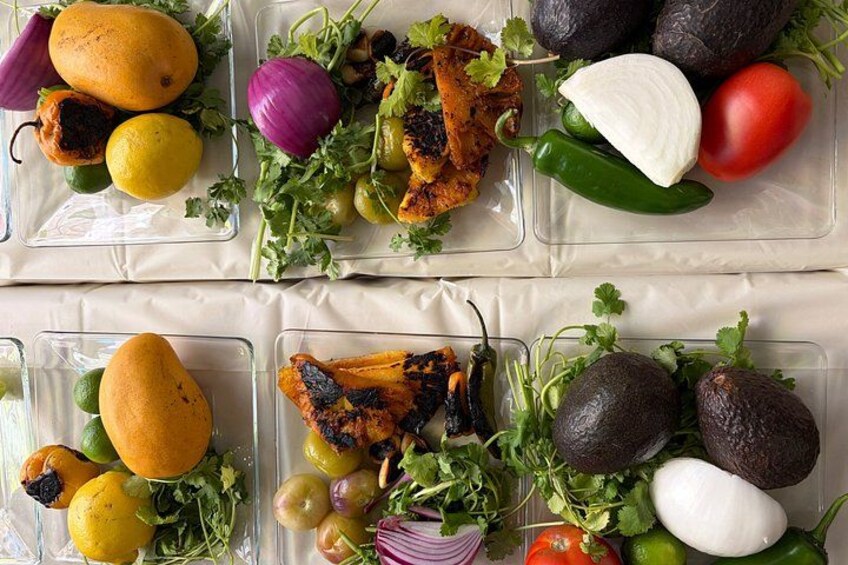 A variety of grilled vegetables and fruits in clear containers. 5