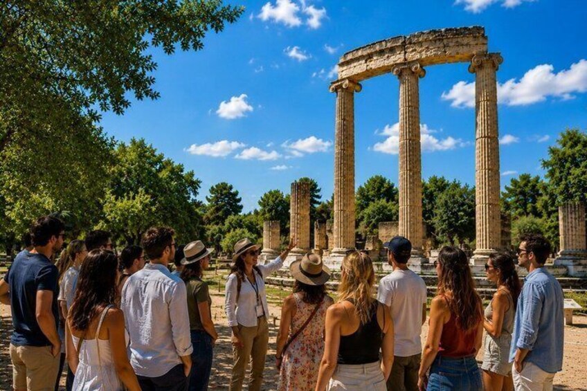 A group of tourists observing ancient columns in a historical site. 2
