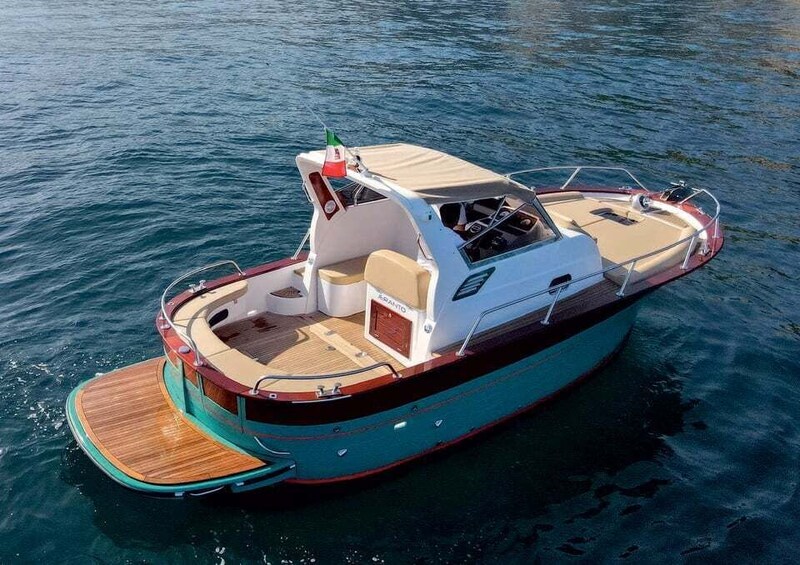 A small motorboat with a wooden deck and a cabin. 2