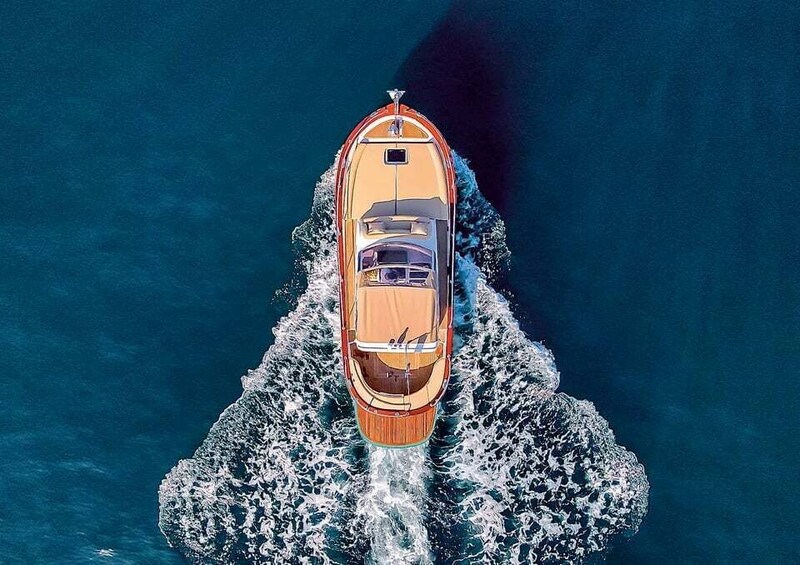 A boat moving through the water, creating a wake behind it. 1