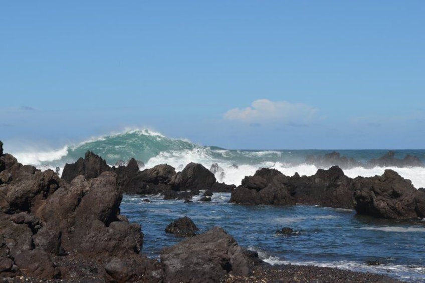A rocky coastline with waves crashing against the rocks. 5