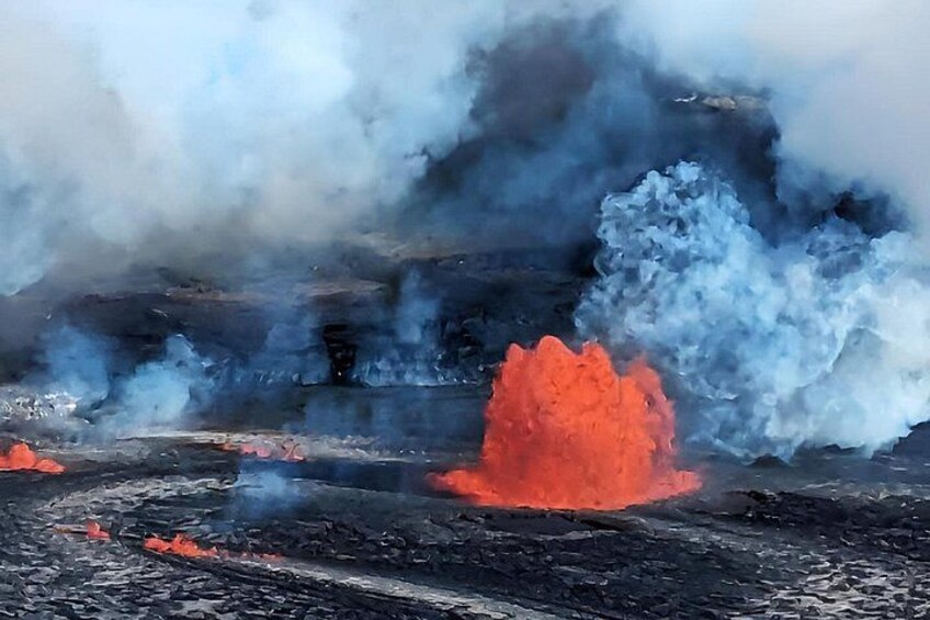 A geothermal area with steam and lava. 4