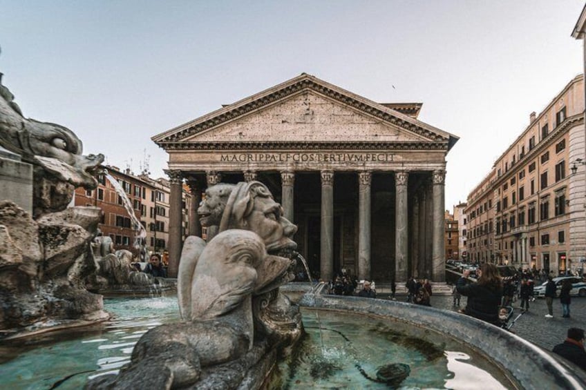 The Pantheon with a central fountain and classical architecture. 4